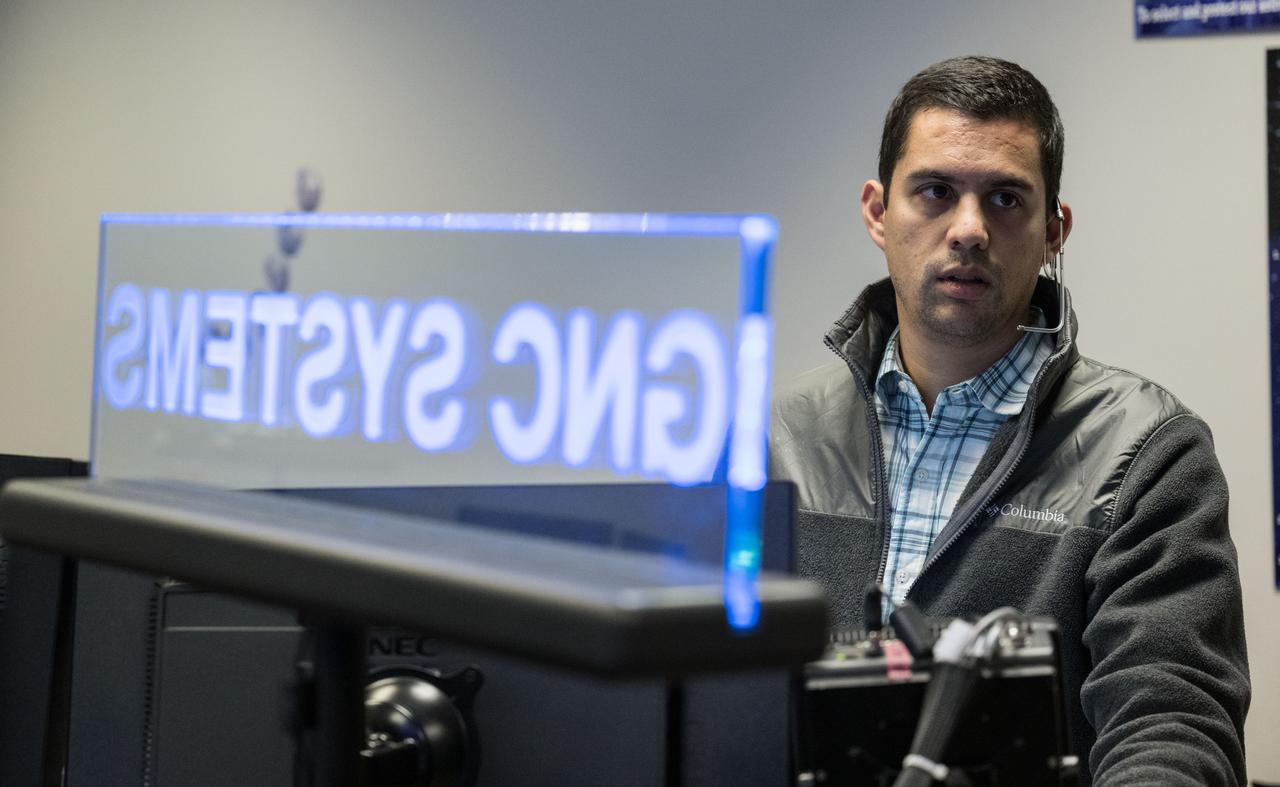 (jsc2022e089789) (Nov.25, 2022) During day 10 of the of the 25.5-day Artemis I mission, flight controllers monitor the progress of the Distant Retrograde Orbit Insertion (DRI) burn. The Distant Retrograde Orbit Insertion (DRI) burn, inserted Orion into a Distant Retrograde Orbit (DRO) where at it's furthest distance Orion will be nearly 270,000 miles from Earth.